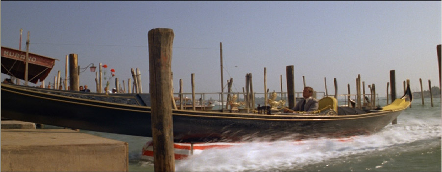 Roger Moore changed costumes five times before he managed to come up md car from the water at St Markusplts in Venice.