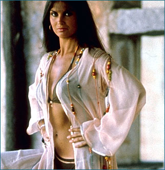 Naomi (played by the sexy British actress Caroline Munro),